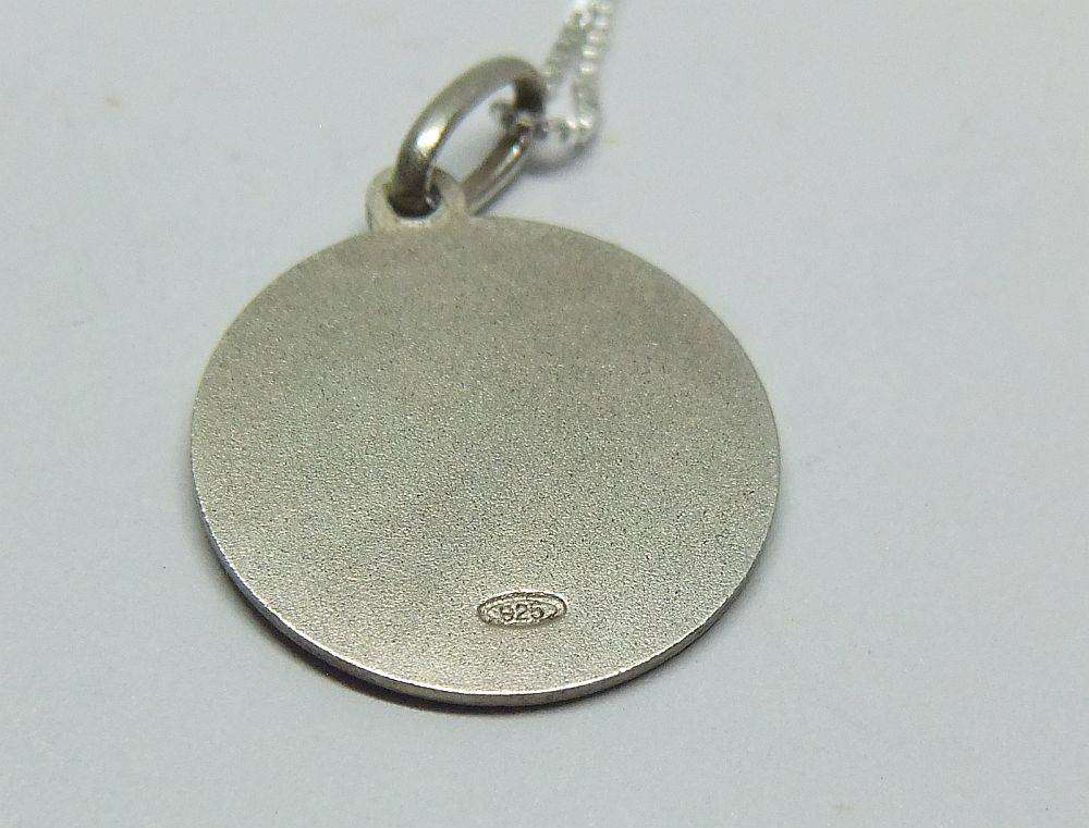 A vintage sterling silver Capricorn Zodiac sign pendant with a sterling silver necklace