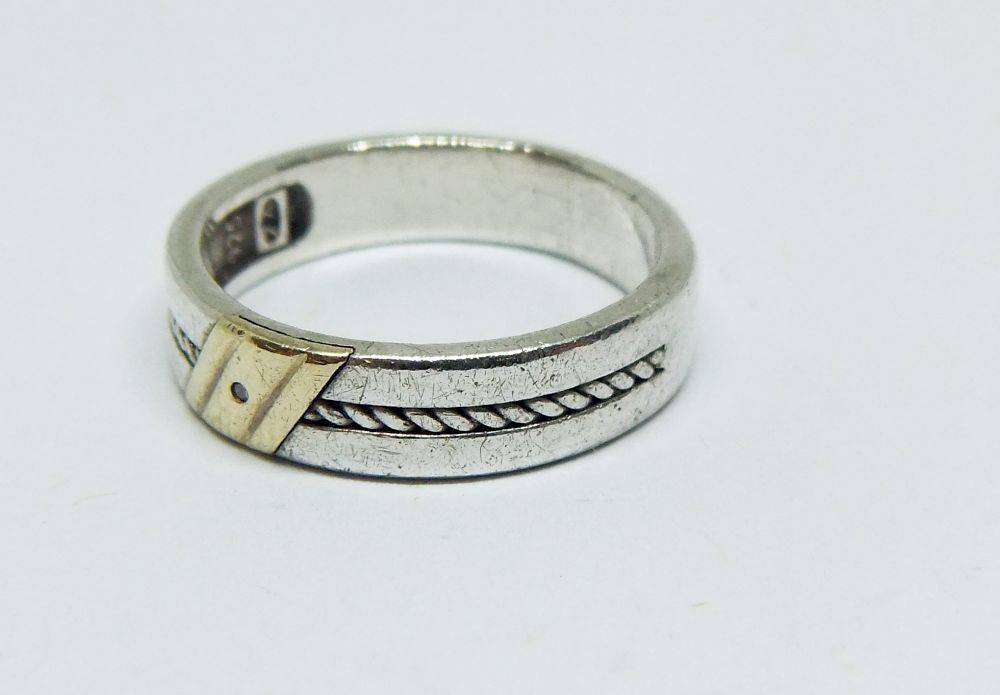 A stylish South African designer sterling silver mens wedding band with gold accent and stone