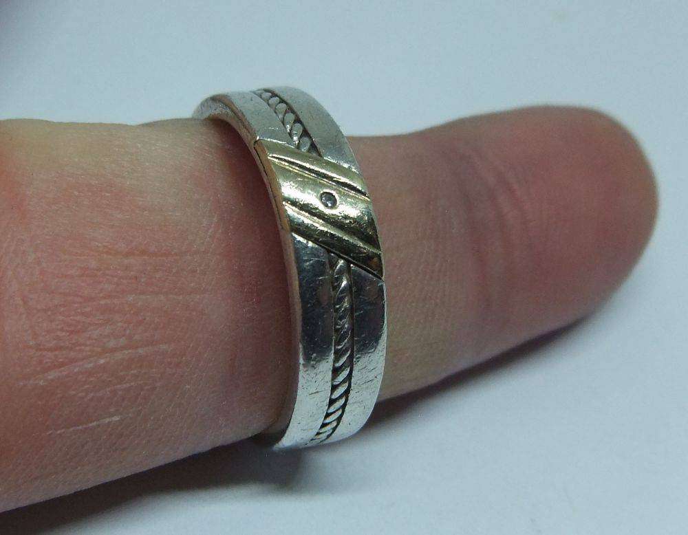 A stylish South African designer sterling silver mens wedding band with gold accent and stone