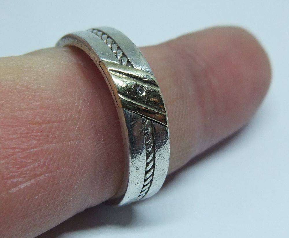 A stylish South African designer sterling silver mens wedding band with gold accent and stone