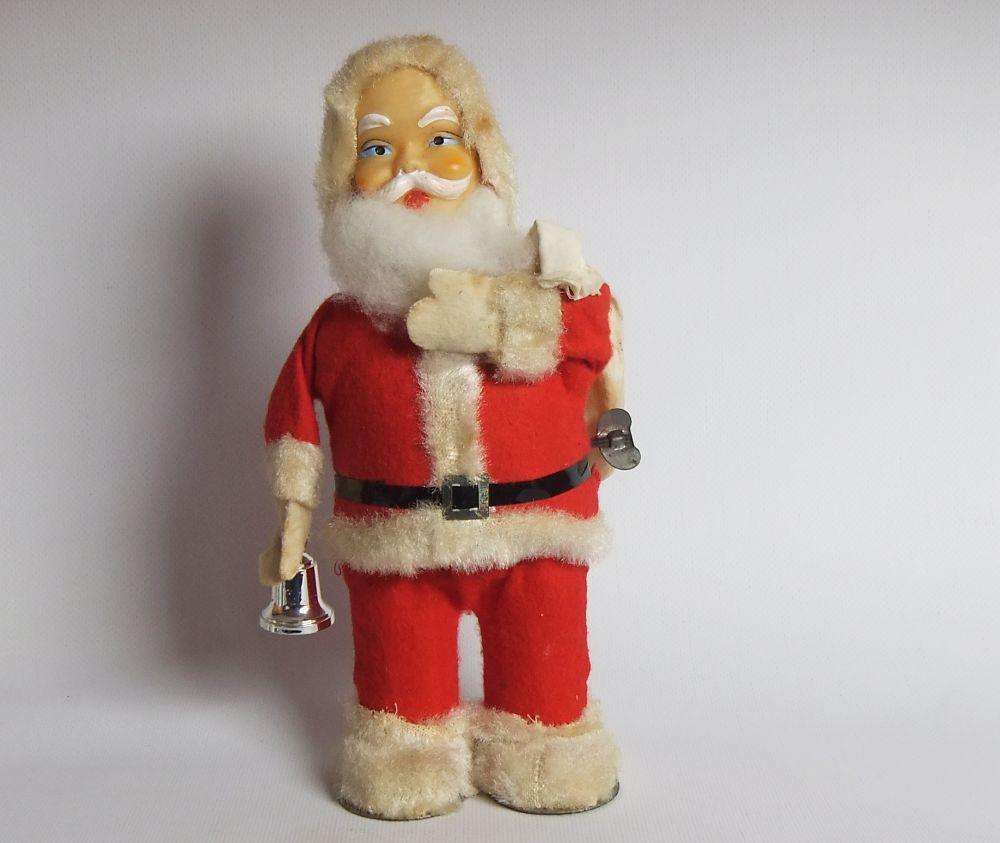 A FUNKY TALL VINTAGE TINPLATE AND CLOTH WIND UP SANTA CLAUS , WORKING BUT NOT NOISY