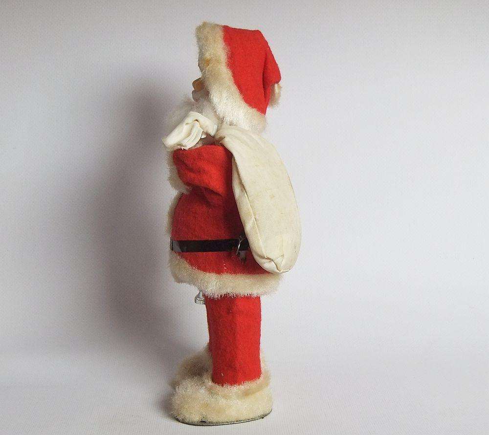 A FUNKY TALL VINTAGE TINPLATE AND CLOTH WIND UP SANTA CLAUS , WORKING BUT NOT NOISY