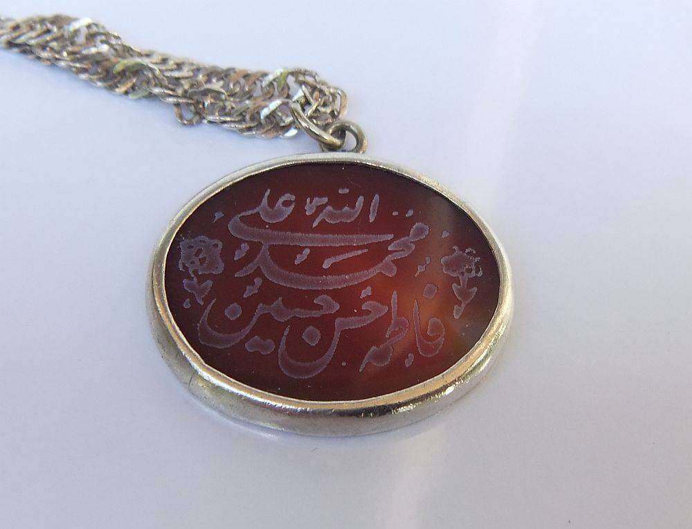 A stunning twist design sterling silver necklace with engraved Carnelian stone 90% silver pendant