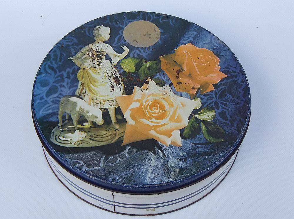 A rusty old tin filled with loads of usable jewelry and spare parts