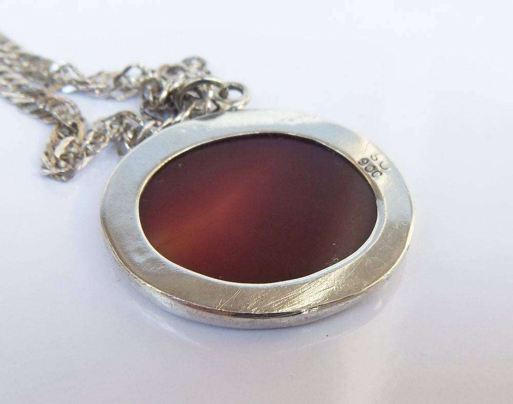 A stunning twist design sterling silver necklace with engraved Carnelian stone 90% silver pendant