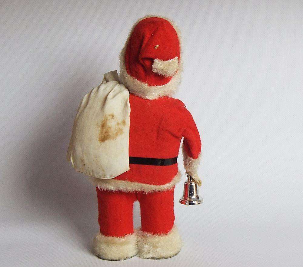A FUNKY TALL VINTAGE TINPLATE AND CLOTH WIND UP SANTA CLAUS , WORKING BUT NOT NOISY