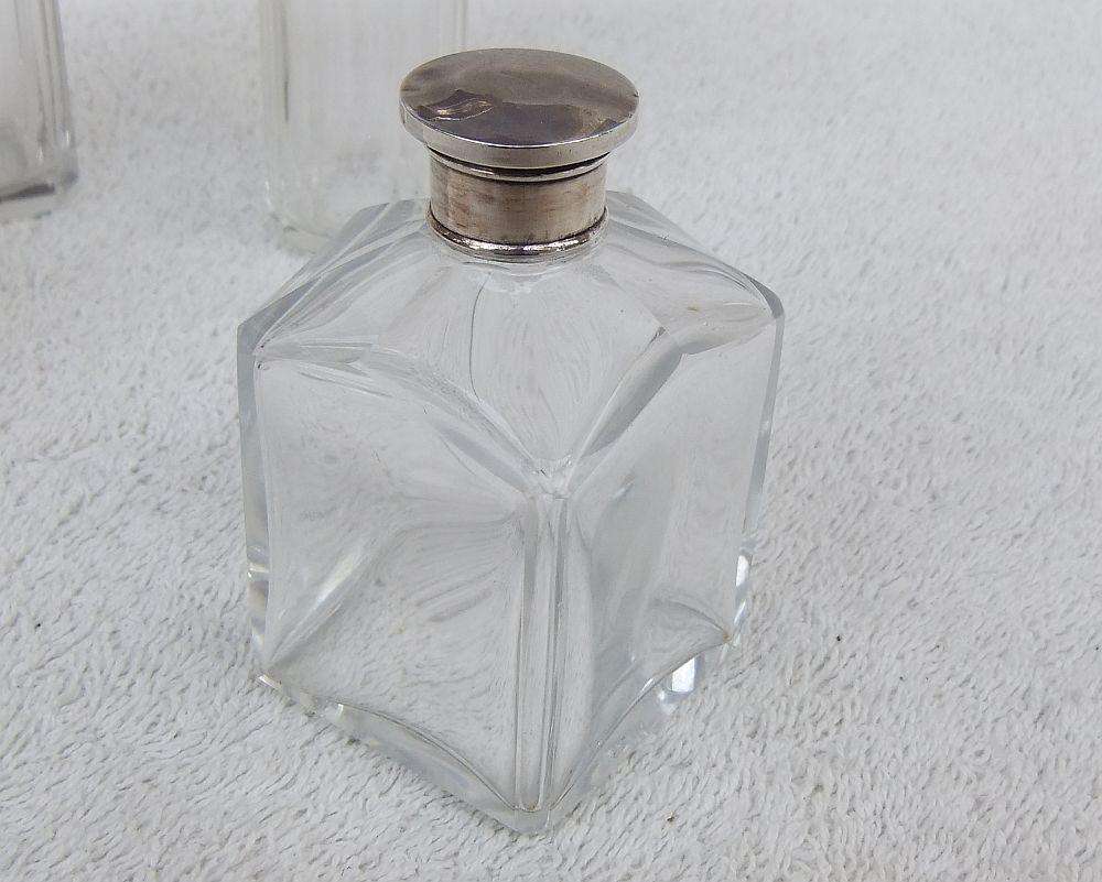 AN ANTIQUE BOTTLE WITH HALLMARKED SILVER COLLAR DATED 1918 , ANOTHER WITH SILVER LID PLUS 2 MORE !!
