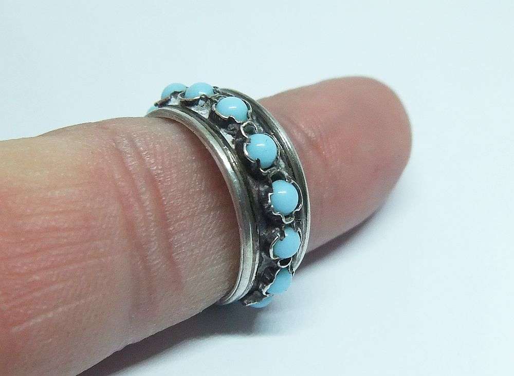 AN EYE CATCHING ADJUSTABLE STERLING SILVER RING SET WITH TURQUOISE COLOURED ORBS !!