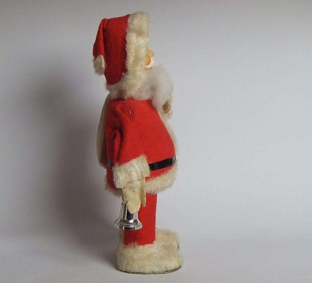 A FUNKY TALL VINTAGE TINPLATE AND CLOTH WIND UP SANTA CLAUS , WORKING BUT NOT NOISY