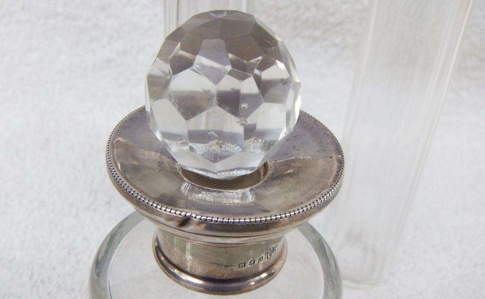 AN ANTIQUE BOTTLE WITH HALLMARKED SILVER COLLAR DATED 1918 , ANOTHER WITH SILVER LID PLUS 2 MORE !!