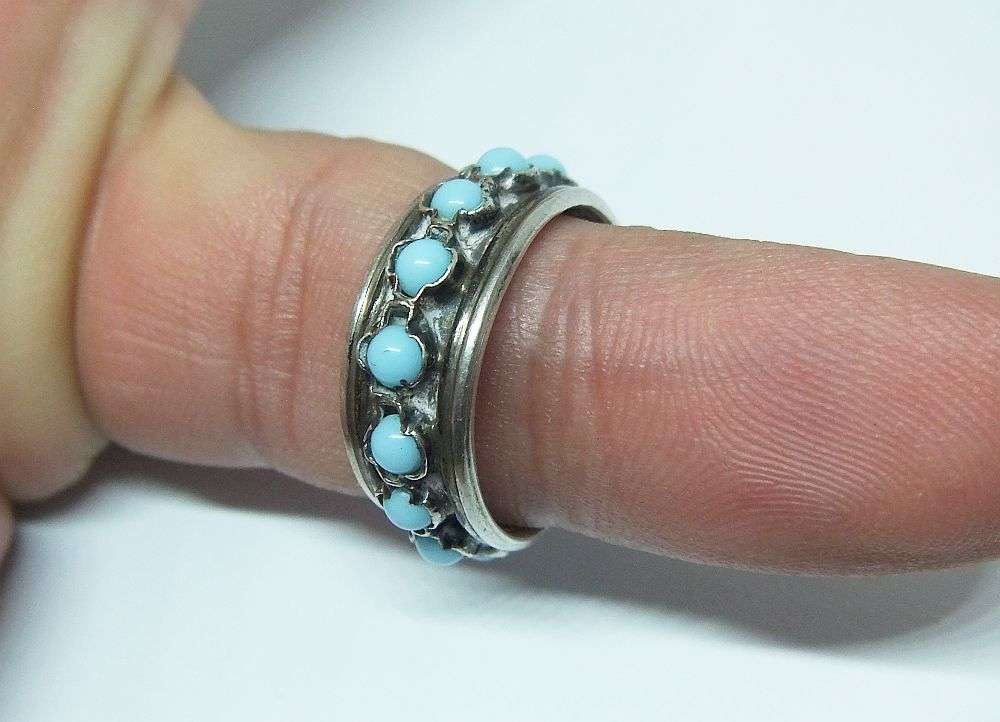 AN EYE CATCHING ADJUSTABLE STERLING SILVER RING SET WITH TURQUOISE COLOURED ORBS !!