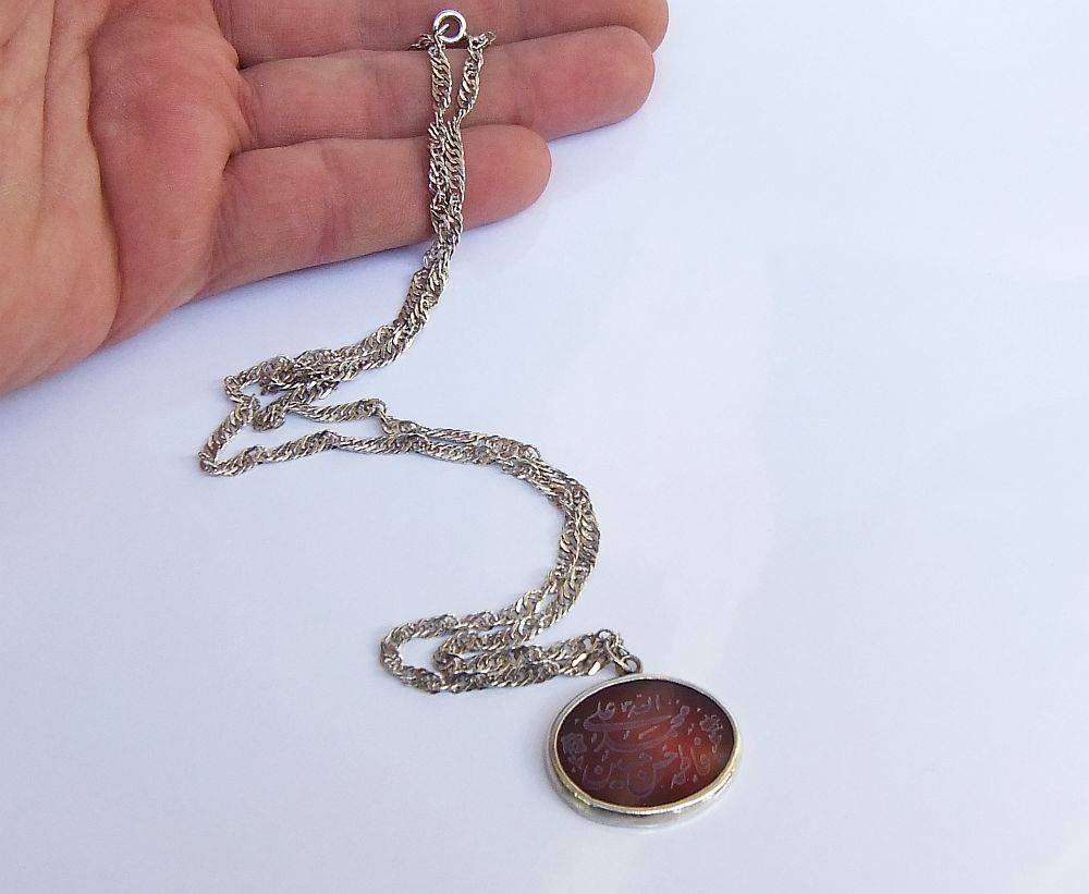 A stunning twist design sterling silver necklace with engraved Carnelian stone 90% silver pendant