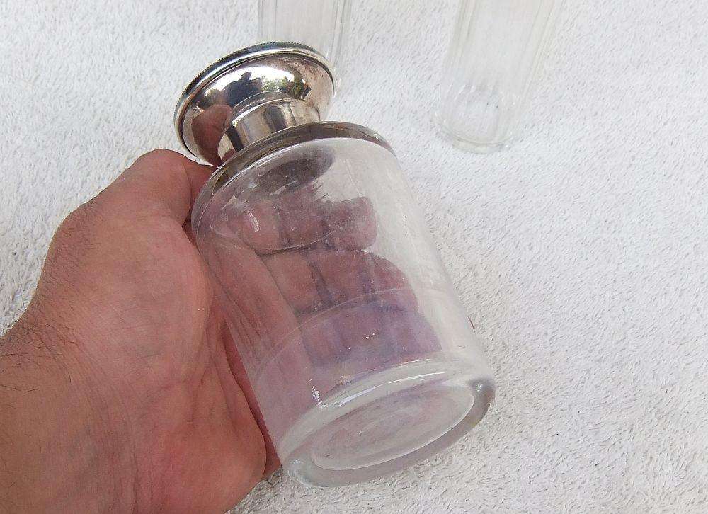 AN ANTIQUE BOTTLE WITH HALLMARKED SILVER COLLAR DATED 1918 , ANOTHER WITH SILVER LID PLUS 2 MORE !!