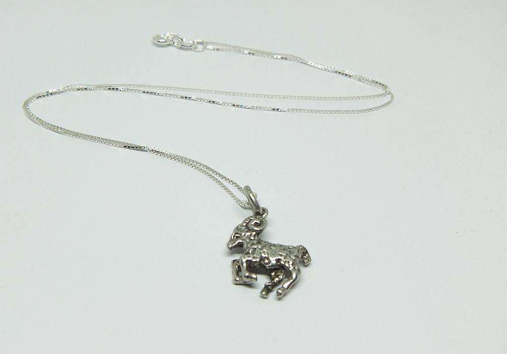 A vintage solid silver Aries Zodiac sign pendant with a sterling silver necklace