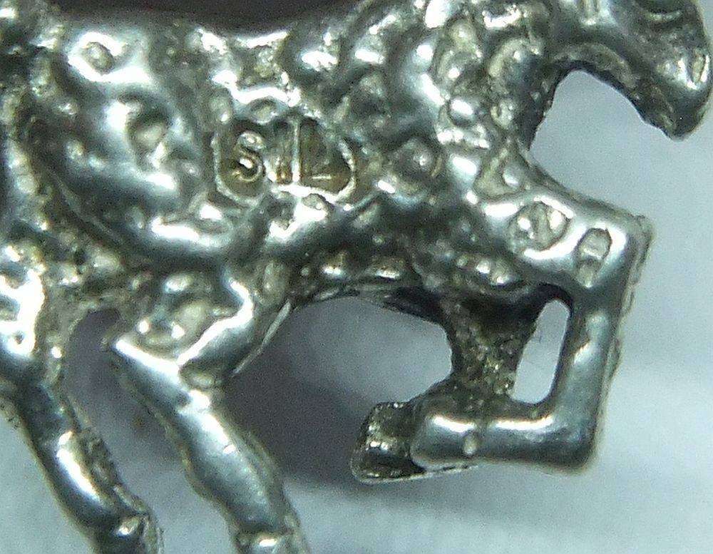A vintage solid silver Aries Zodiac sign pendant with a sterling silver necklace