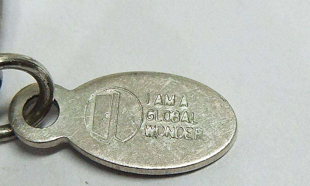 A beautiful hand made genuine pearl and metal bead necklace by Global Wonders in unworn condition