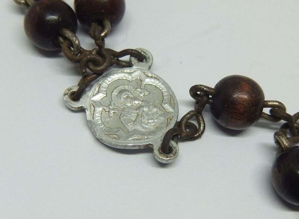 A CHARMING VINTAGE WOOD BEAD ROSARY WITH METAL CRUCIFIX MADE IN GERMANY