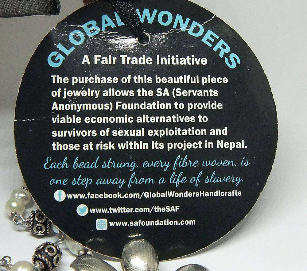 A beautiful hand made genuine pearl and metal bead necklace by Global Wonders in unworn condition