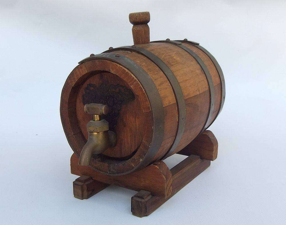 An awesome vintage oak wine barrel with brass bands and tap in great cosmetic condition