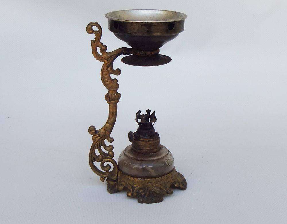 An antique Vapo Cresolene vaporizer with original box patented in the 1880's