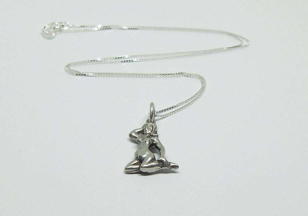 A vintage solid silver Virgo Zodiac sign pendant with a sterling silver necklace