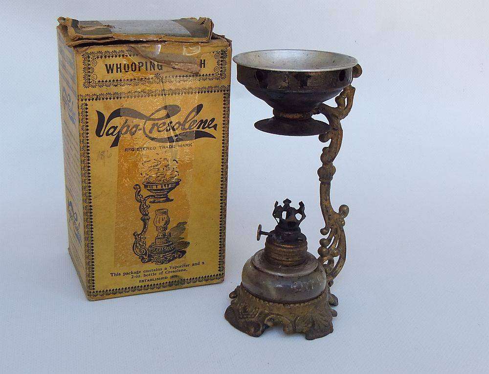 An antique Vapo Cresolene vaporizer with original box patented in the 1880's