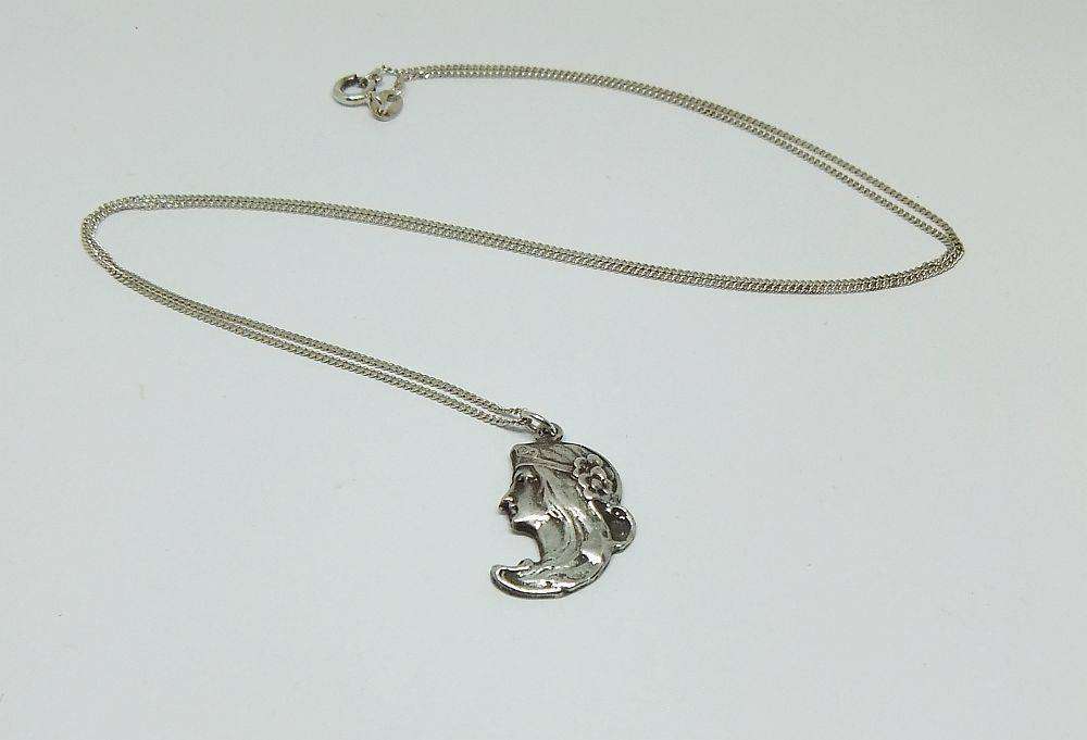 A beautiful solid sterling silver Art Nouveau style pendant with a sterling silver necklace