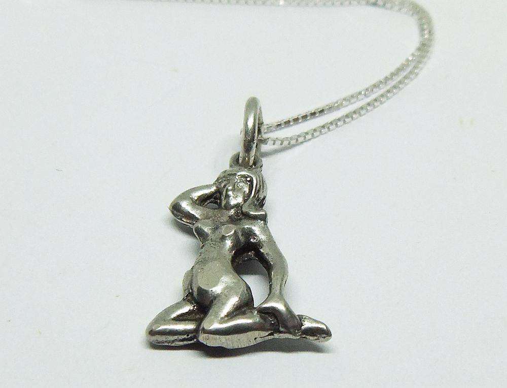 A vintage solid silver Virgo Zodiac sign pendant with a sterling silver necklace