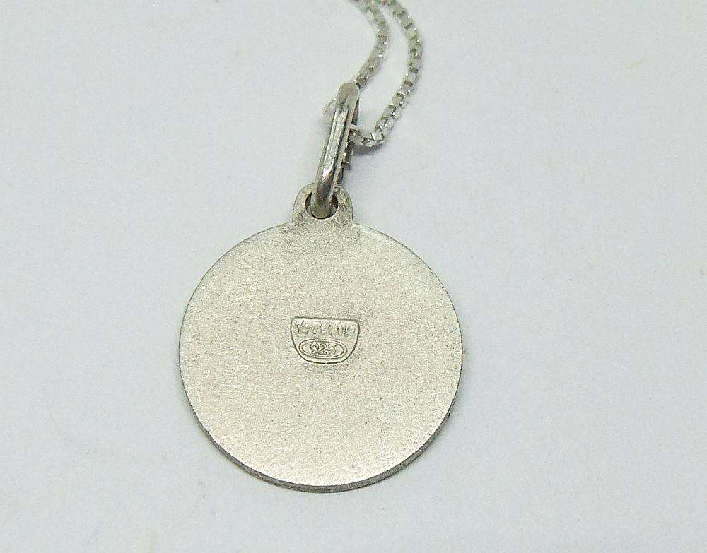 A vintage sterling silver Taurus Zodiac sign pendant plus a sterling silver necklace