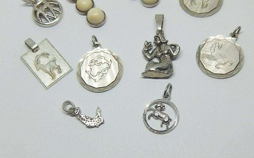 A lot of 9 vintage solid silver pendants and one sterling silver island charm