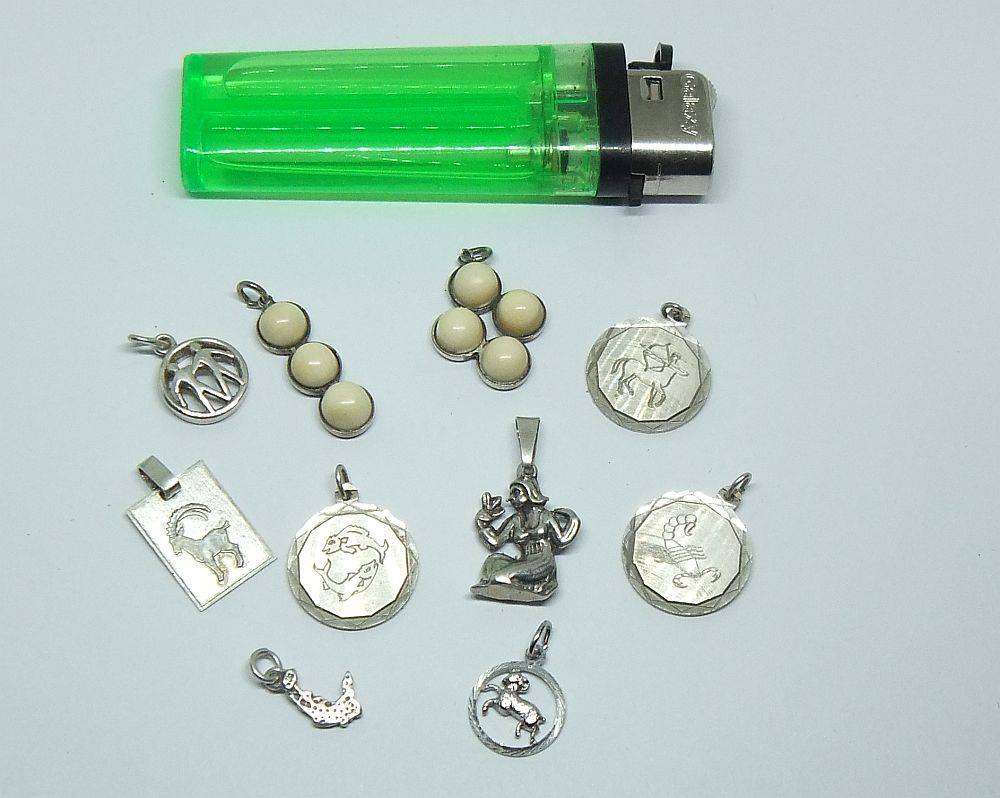 A lot of 9 vintage solid silver pendants and one sterling silver island charm