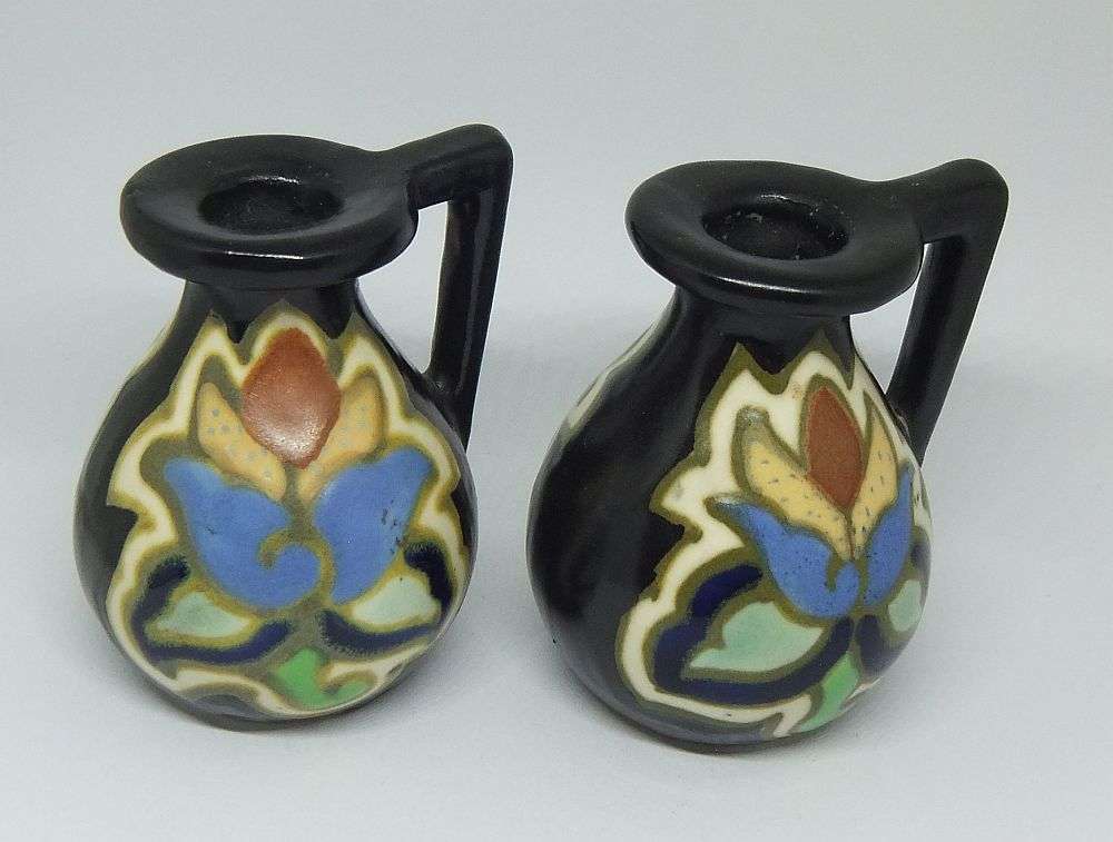 A VINTAGE PAIR OF GOUDA STYLE HAND PAINTED MINIATURE EWER ORNAMENTS