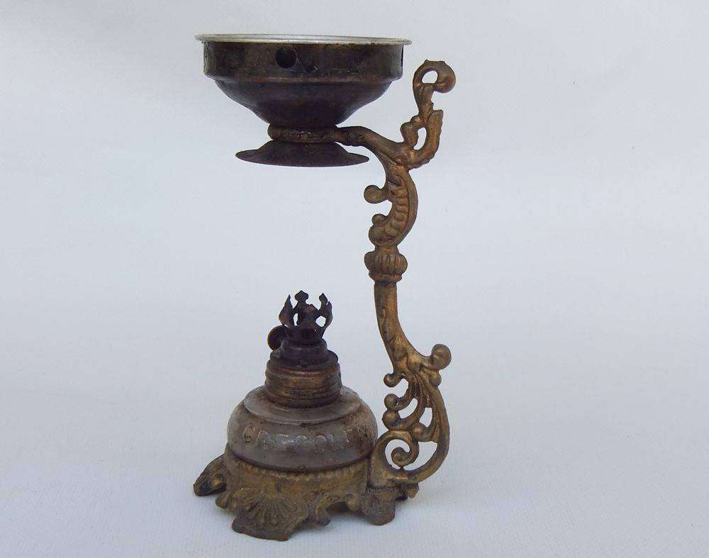 An antique Vapo Cresolene vaporizer with original box patented in the 1880's