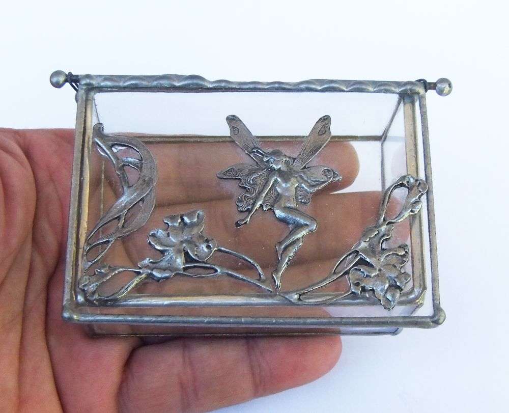 A VINTAGE LEAD AND GLASS TRINKET BOX WITH FAIRY MOTIF AND ART NOUVEAU PATTERN