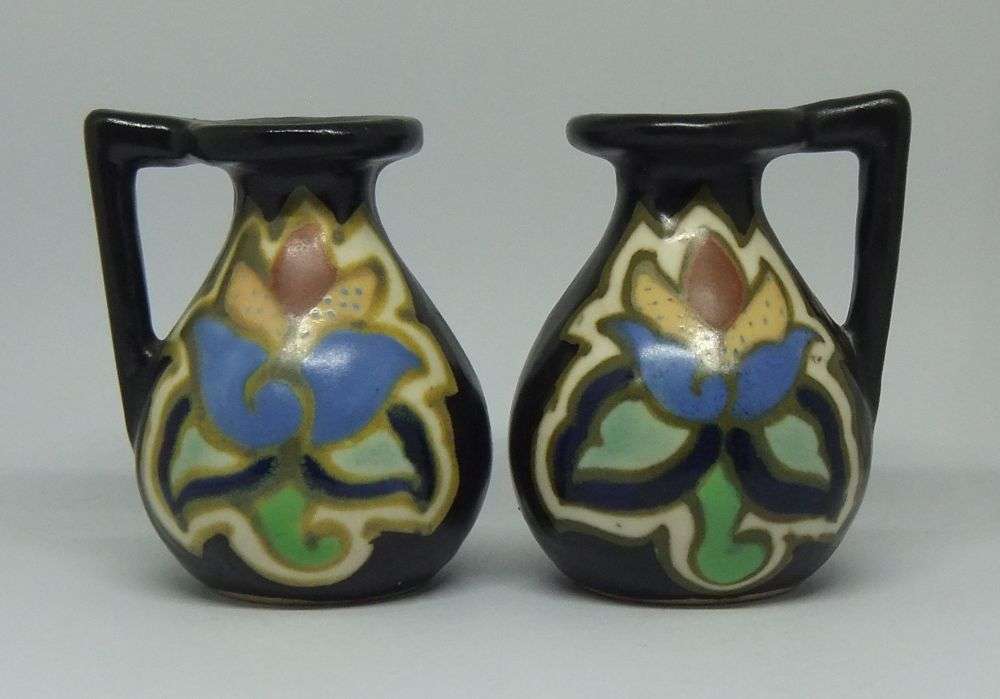 A VINTAGE PAIR OF GOUDA STYLE HAND PAINTED MINIATURE EWER ORNAMENTS