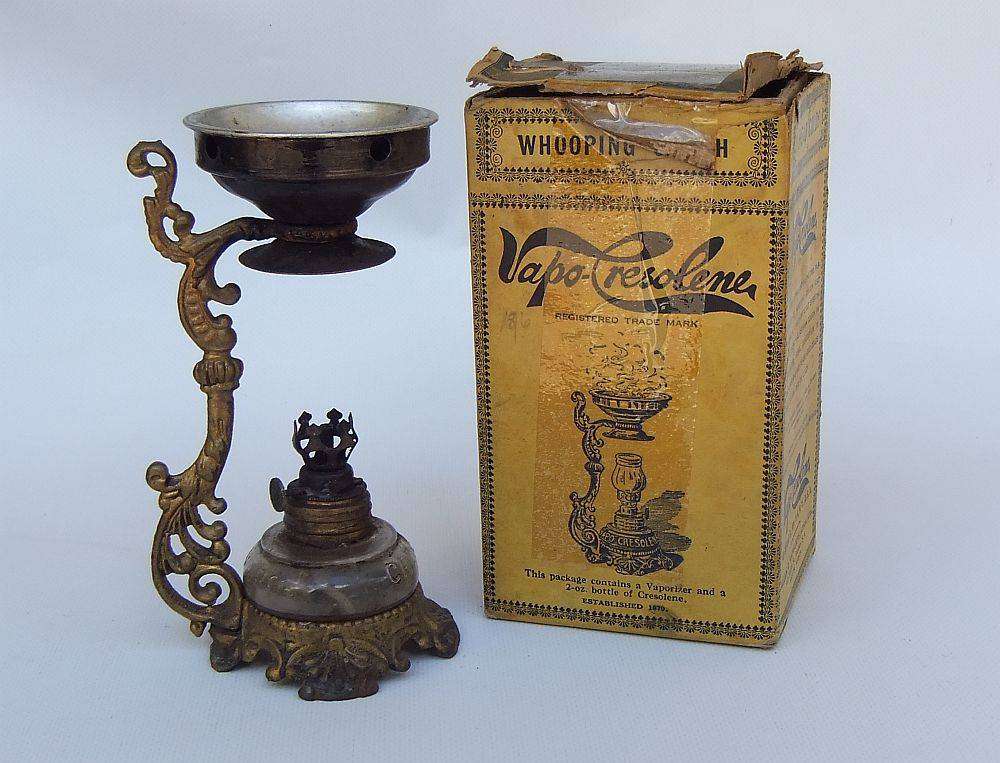 An antique Vapo Cresolene vaporizer with original box patented in the 1880's
