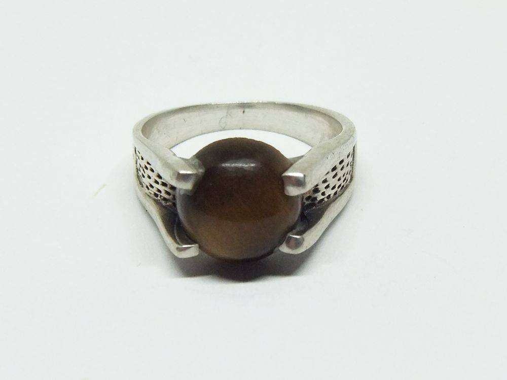 A superior quality vintage sterling silver ring set with a cabochon genuine Tigers eye stone