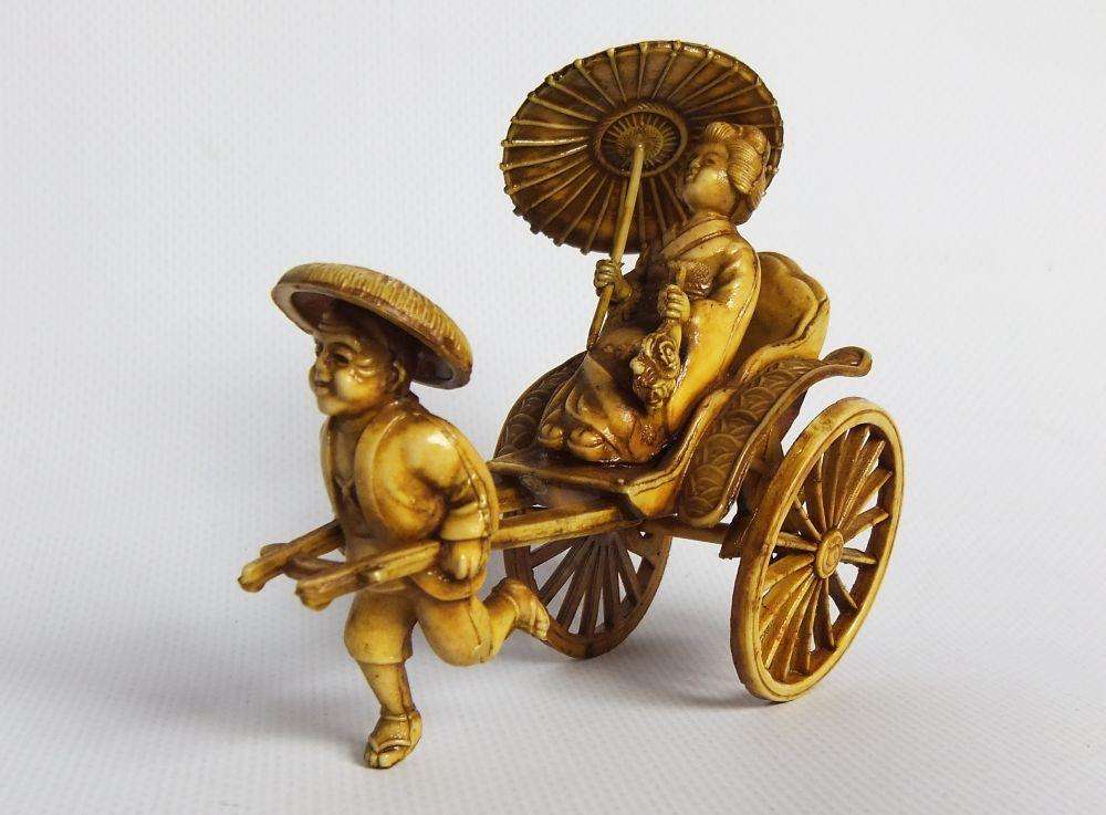A HIGHLY DETAILED AND DELICATE VINTAGE JAPANESE CELLULOID RICKSHAW AND GEISHA ORIENTAL FIGURINE