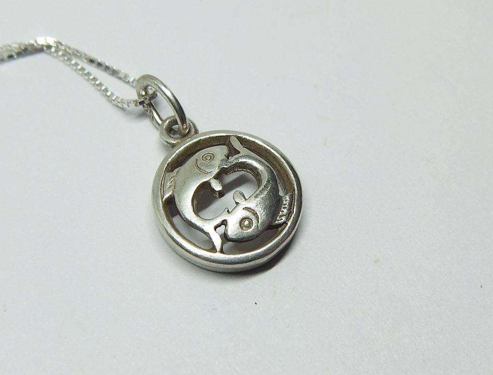 A vintage German 835 silver Pisces Zodiac sign pendant plus a sterling silver necklace