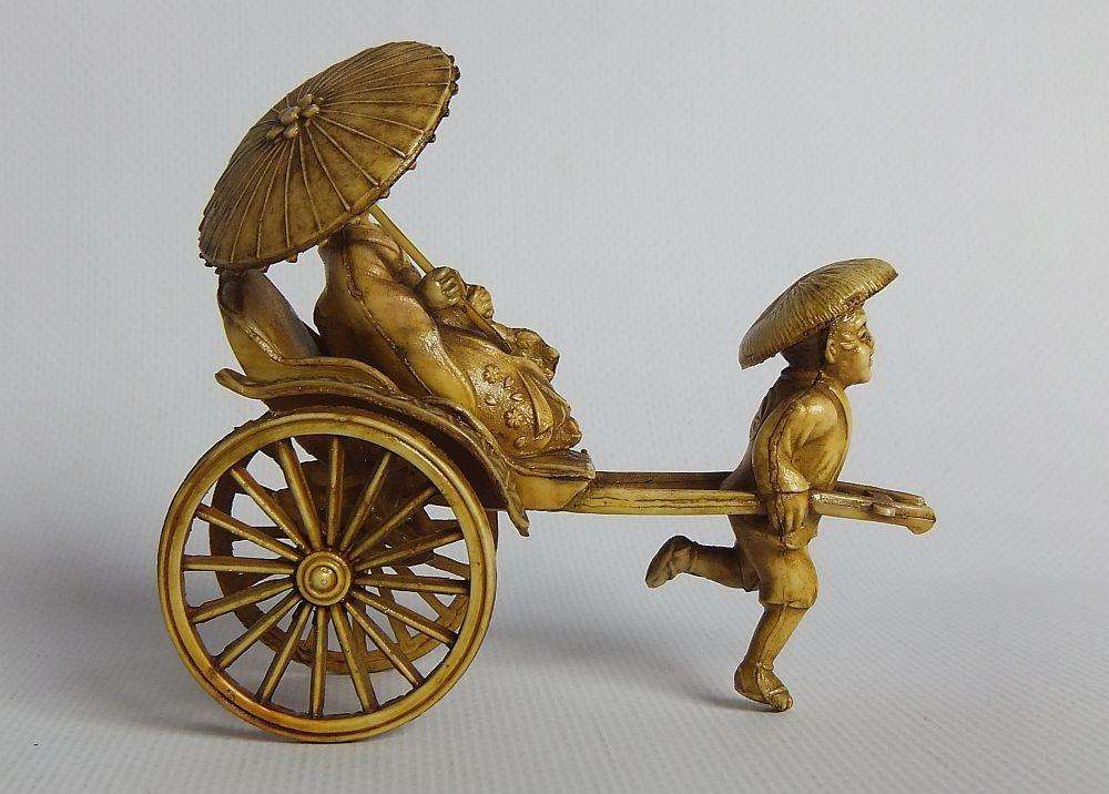 A HIGHLY DETAILED AND DELICATE VINTAGE JAPANESE CELLULOID RICKSHAW AND GEISHA ORIENTAL FIGURINE