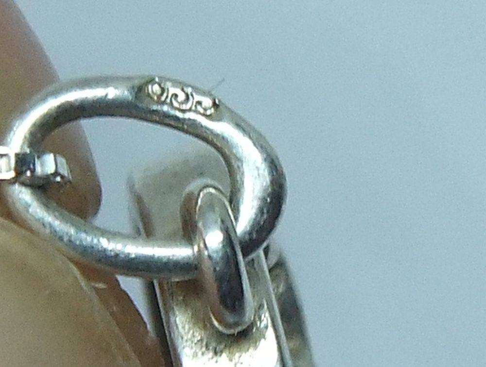 A vintage German 835 silver Gemini Zodiac sign pendant plus a sterling silver necklace