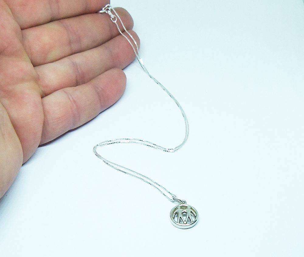 A vintage German 835 silver Gemini Zodiac sign pendant plus a sterling silver necklace