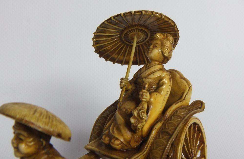 A HIGHLY DETAILED AND DELICATE VINTAGE JAPANESE CELLULOID RICKSHAW AND GEISHA ORIENTAL FIGURINE