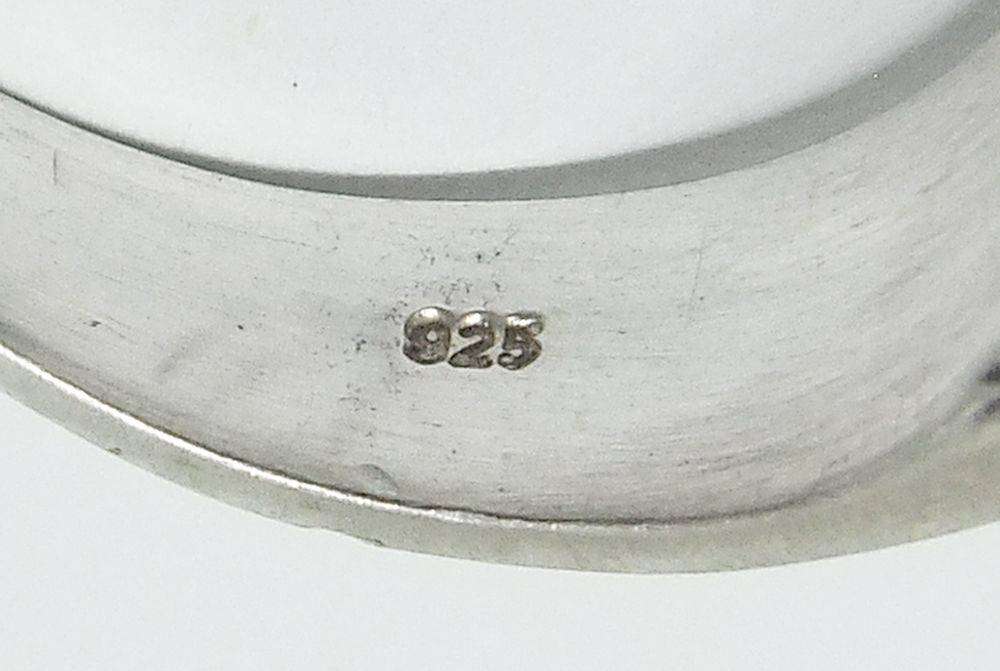 A superior quality vintage sterling silver ring set with a cabochon genuine Tigers eye stone