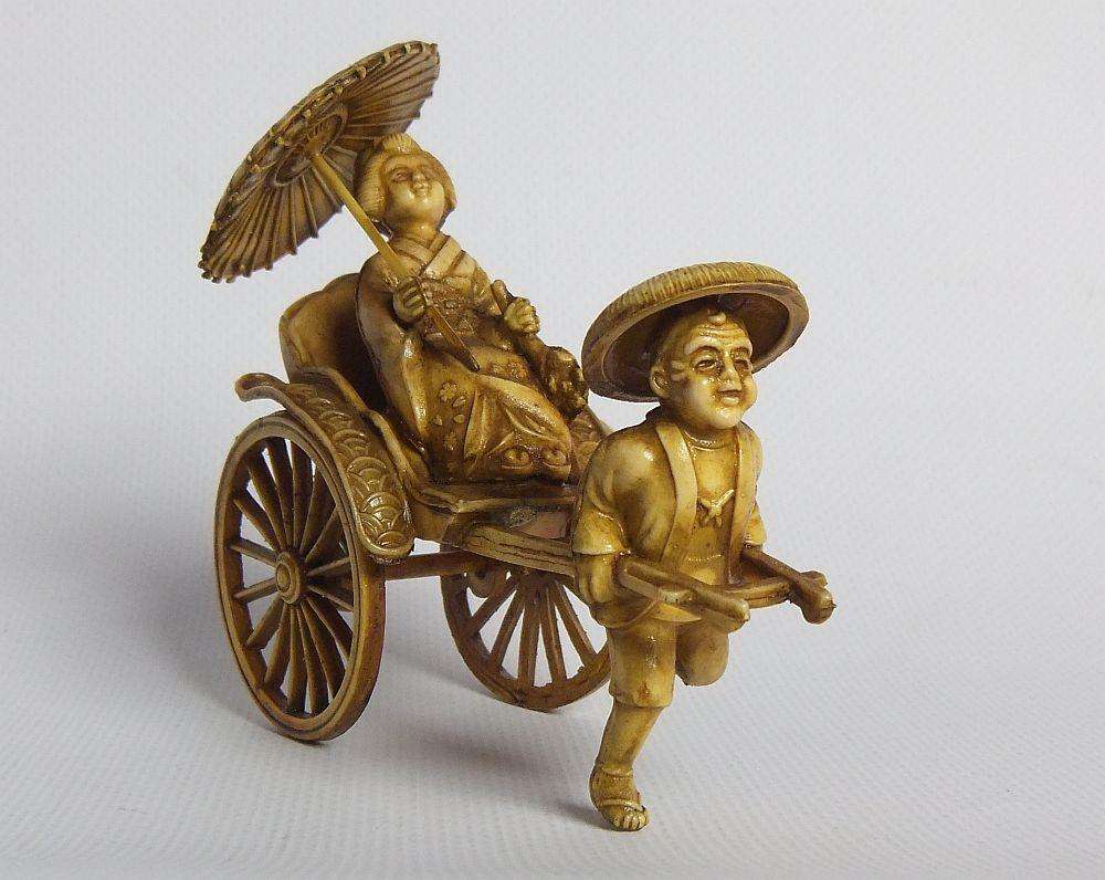 A HIGHLY DETAILED AND DELICATE VINTAGE JAPANESE CELLULOID RICKSHAW AND GEISHA ORIENTAL FIGURINE