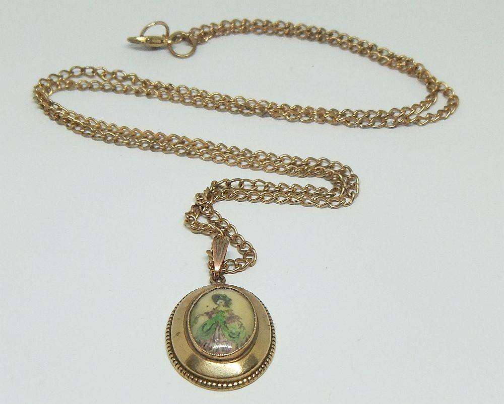 A lovely vintage rolled gold Thomas L Mott pendant with lady theme plus free plated necklace