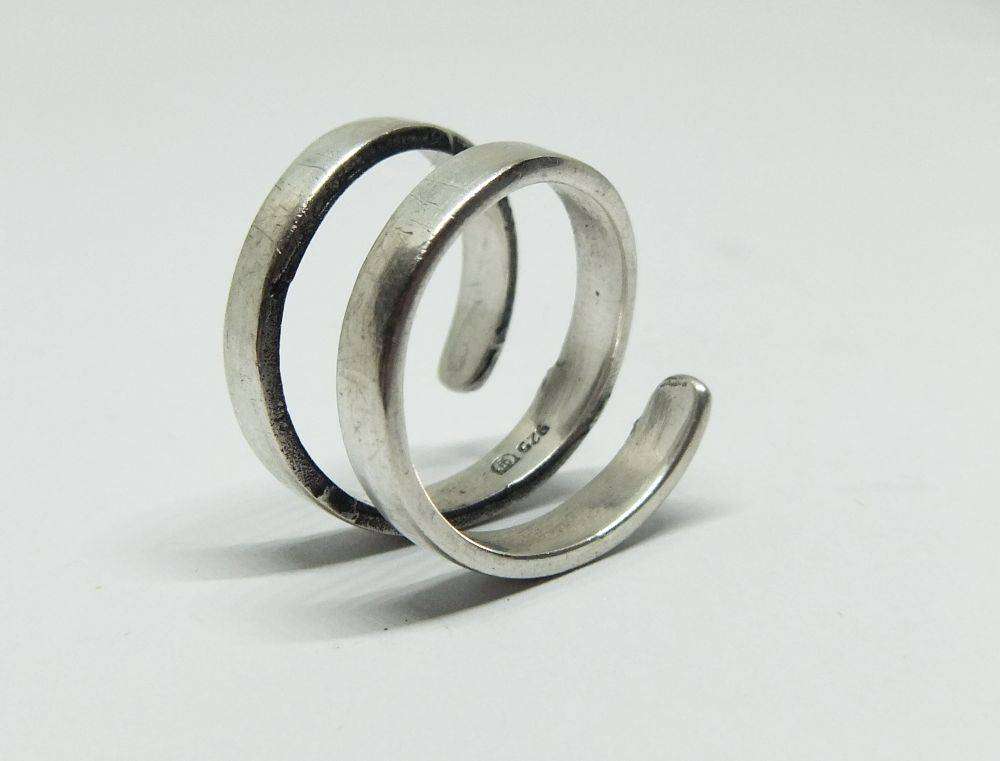 A very unusual sterling silver spiral form ring with designer stamp