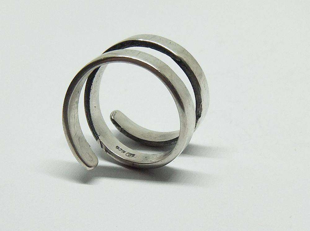A very unusual sterling silver spiral form ring with designer stamp