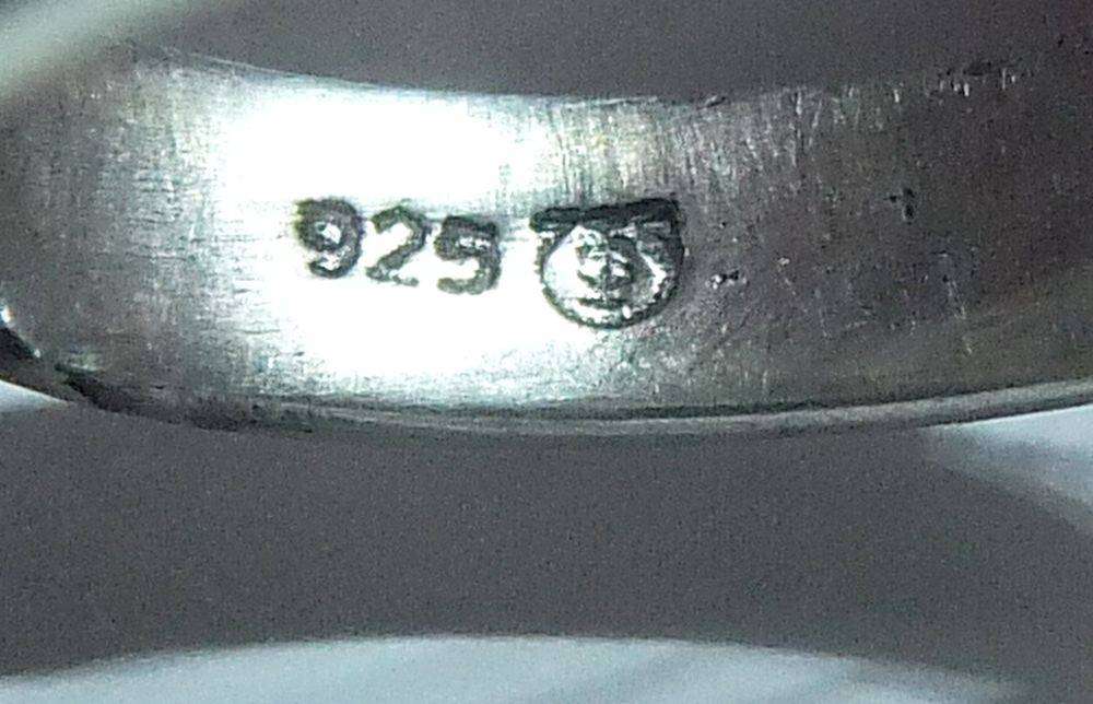 A very unusual sterling silver spiral form ring with designer stamp