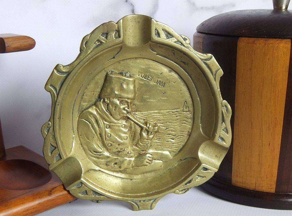 A grand assortment of vintage pipe smokers accessories including tobacco jar , pipe stand and more